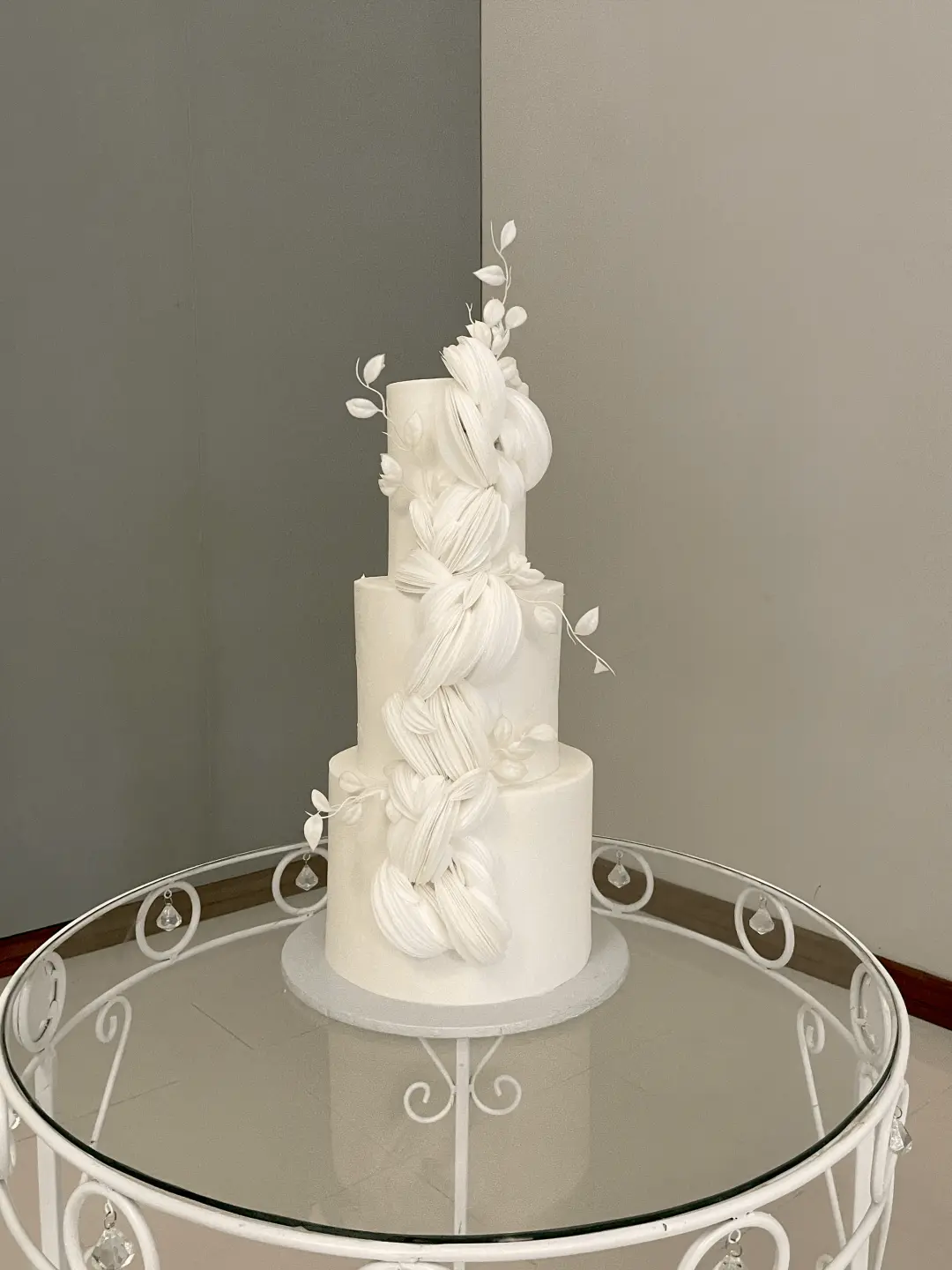Tall bespoke wedding cake with textured details